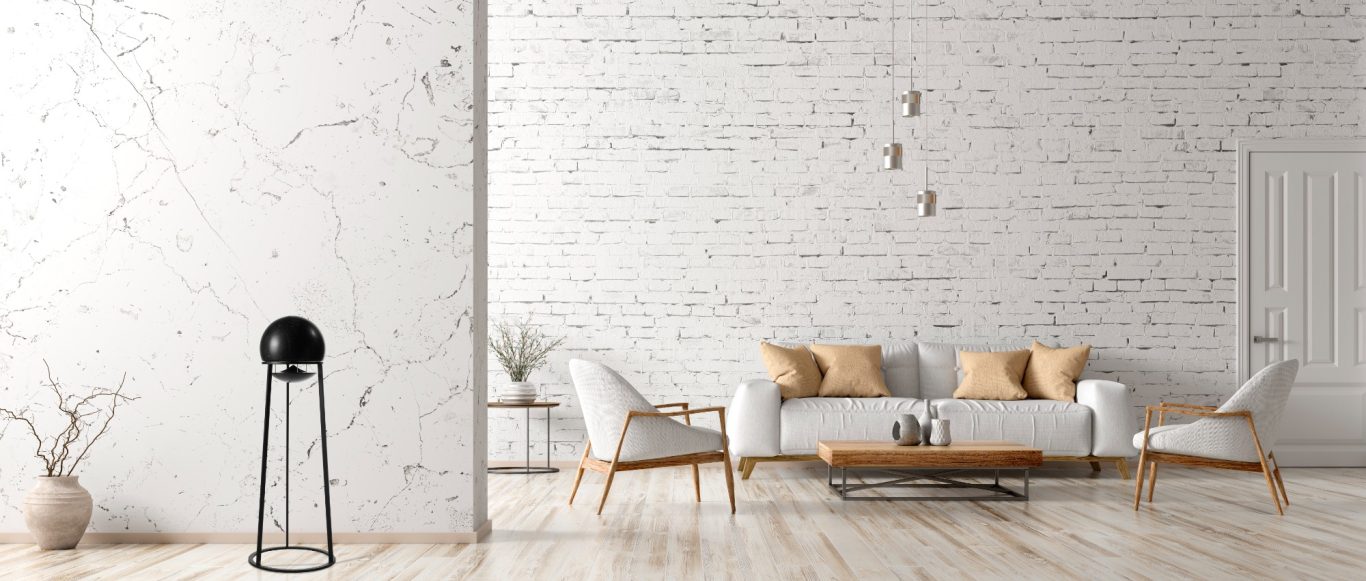 Standlautsprecher Modern Wohnzimmer mit weißer Wand, Holzdekoren und einer stilvollen Sofagruppe.